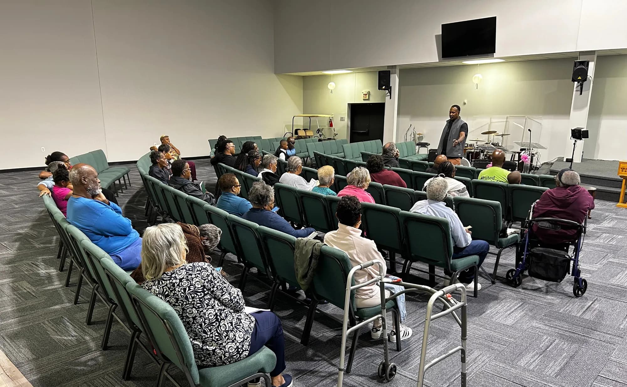 Members seated in the Family Life Center sanctuary