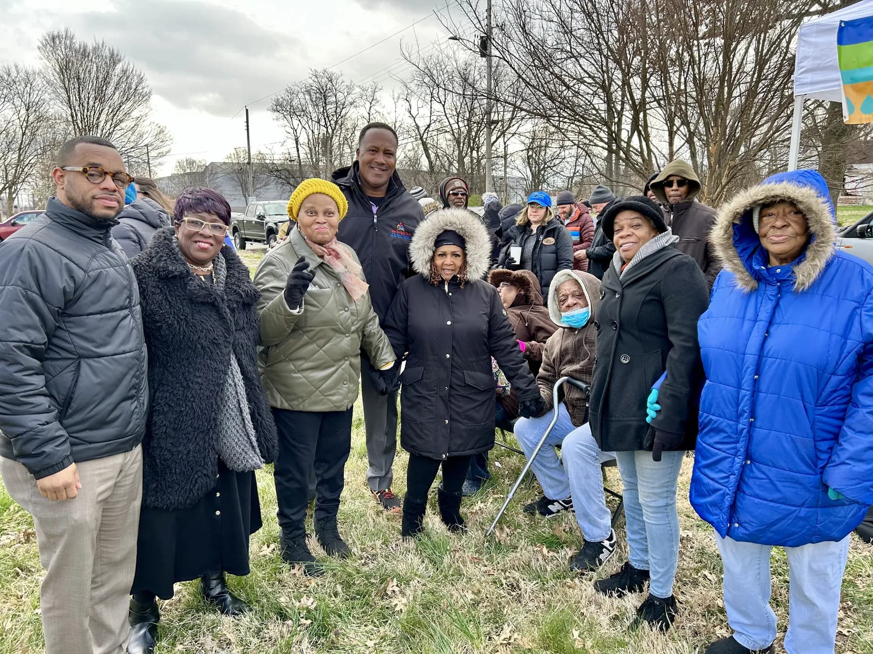 Church members gathered outdoors on a cold day