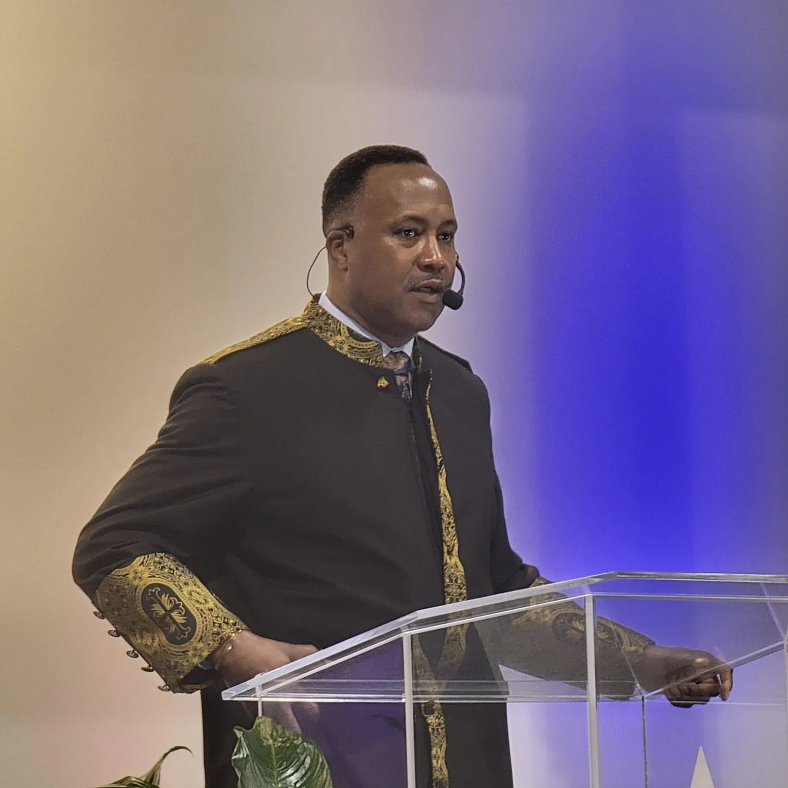 Pastor Marcus S. Moses preaching from the pulpit
