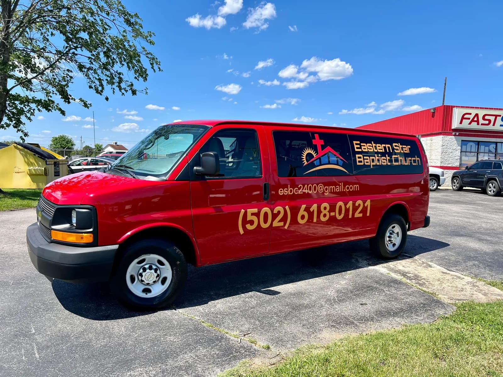 The red Eastern Star Baptist Church van